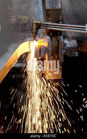 Steel fabricator flame cutting with gas torch part of metal fabrication in UK factory Stock Photo