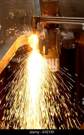 Steel fabricator flame cutting with gas torch part of metal fabrication in UK factory Stock Photo