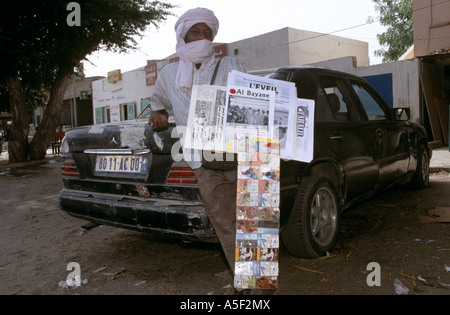 Newspaper salesman on street, Nouakchott, Mauritania Stock Photo