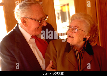 Senior couple gazing affectionately at each other age 75.  St Paul Minnesota USA Stock Photo