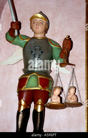 Statue of holy archangel Saint Miguel St Michael holding balancing scales at Parish church Igreja Matriz  Alvor Algarve Portugal Stock Photo