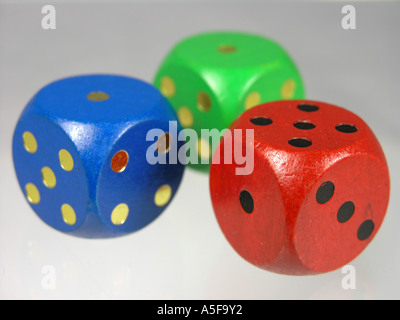 Three Wooden Coloured Dice Stock Photo