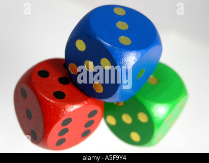 Three wooden dice piled Stock Photo