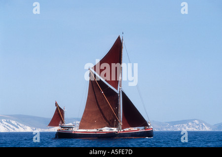 The 1900 spritsail barge Ironsides now used for charter sailing off Weymouth in Dorset England UK Stock Photo