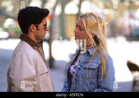 A man and woman talking close to each other in Majorca Spain Stock Photo
