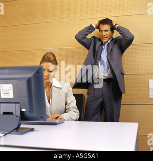 Businesswoman and man at a computer 3 Stock Photo