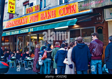 Paris France , Large Crowd People Lining up, Queuing Outside Vietnamese Restaurant in Chinatown 'Pho Banh Cuon 14' Stock Photo