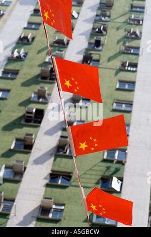 Chinese Flags Flying in front of Apartment Building Hong Kong China Stock Photo