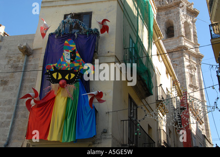 Decorative art on the wall above a fancy dress shop in the old quarter, Valencia, Spain Stock Photo