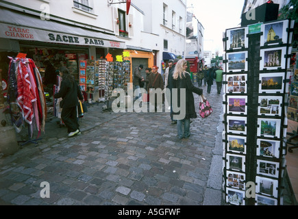 Tourists and visitors in a street of Montmartre a favorite destination for people visiting Paris Stock Photo