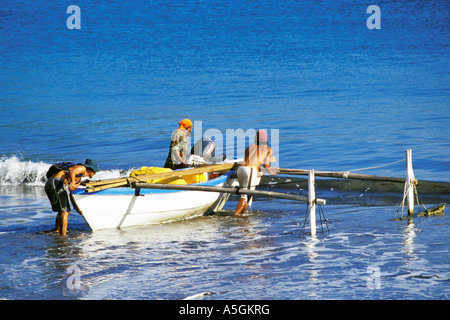 Fishermen with a boat, French Polynesia, Nuku Hiva Stock Photo