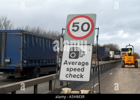 Average Speed camera warning sign, in roadworks, M1 Motorway, South Yorkshire, UK Stock Photo