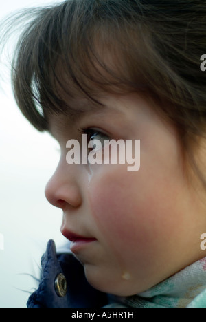 close-up of a little girl with tears in her eyes Stock Photo