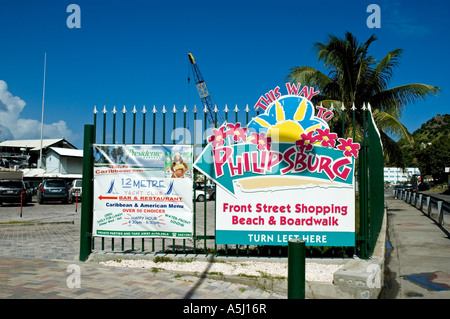 Colourful Sign pointing the way to the shopping, beach and boardwalk,  St Maarten Stock Photo