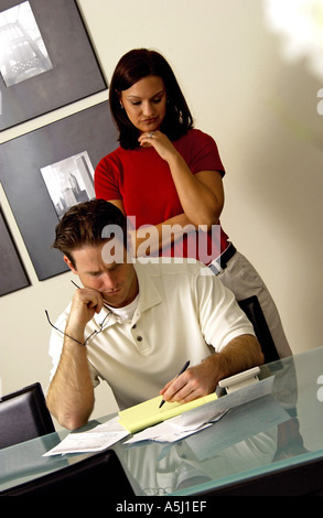 Couple looking over bills Stock Photo