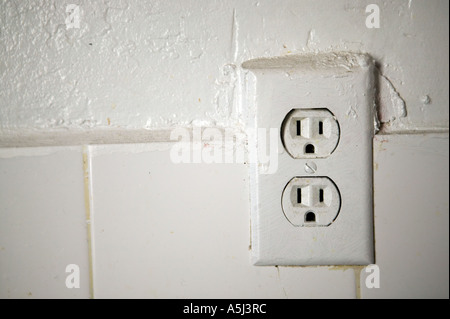 View of a double white electric American socket on a wall February 2006 Stock Photo