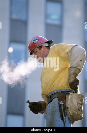 Iron worker connector Joe Emerson on a steel beam at the new Random House building at 1745 Broadway in New York City. Stock Photo