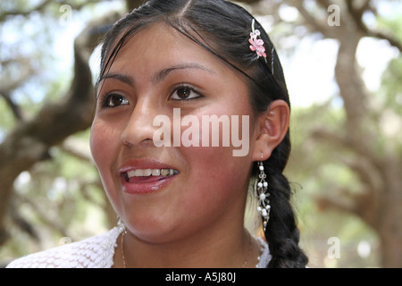 Young traditional woman with a golden tooth in Tiataco, Cochabamba, Bolivia Stock Photo