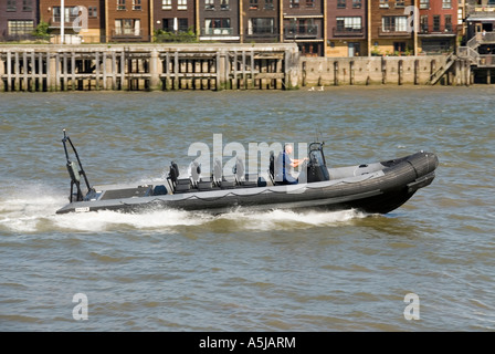River Thames fast response inflatable motor patrol boat travelling at high speed Stock Photo