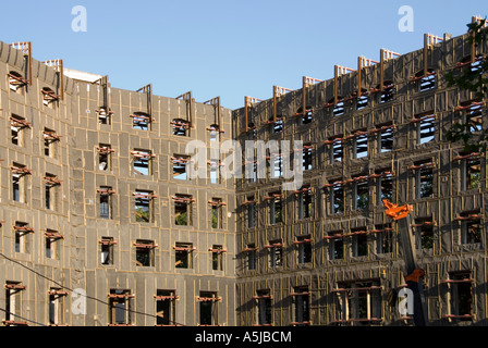 Temporary steel shoring for support to retained masonry facade of  old Marconi House demolition & built into new structure Aldwych London England UK Stock Photo