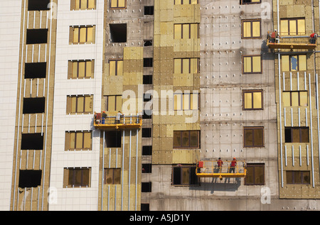 Construction Workers On Cradle Stock Photo