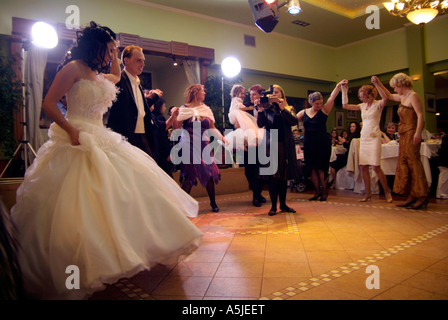 Pontian Circle dancing at a Greek Orthodox wedding reception where relatives and friends are celebrating Stock Photo
