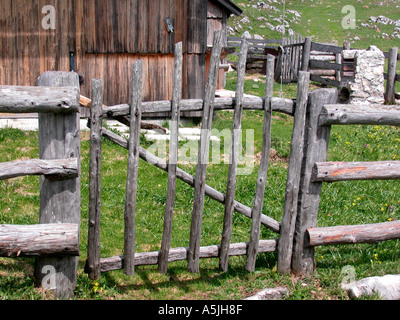 gate to a Alpine hut in the Alps on the plateau Velinka Planina in Slovenia Stock Photo