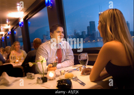 Couple enjoying a Dinner Cruise on the Odyssey in Chicago Illinois Stock Photo