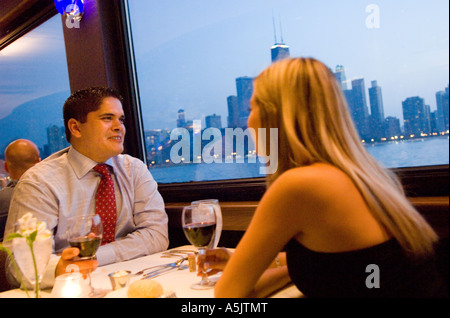 Couple enjoying a Dinner Cruise on the Odyssey in Chicago Illinois Stock Photo