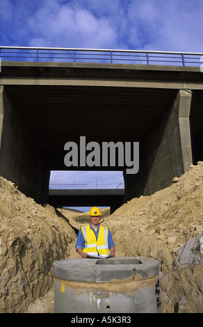 surveyor on site of road bridge construction on motorway yorkshire uk Stock Photo