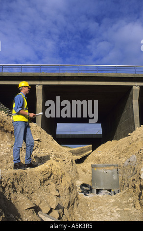 surveyor consulting plans for construction of road bridge on motorway yorkshire uk Stock Photo