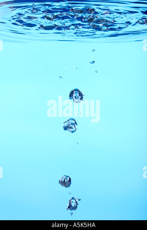 water and air bubbles and water surface from below Stock Photo