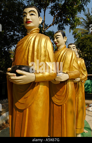 Statues of monks in a monastery, Yangon, Myanmar Stock Photo