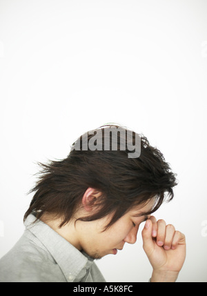 Young man in depressed mood Stock Photo