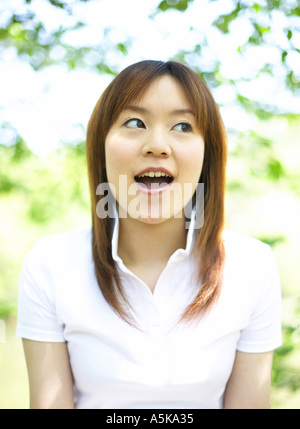 Young woman looking sideway Stock Photo