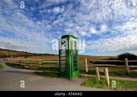 A British Telecom green K6 telephone box on a quiet county lane in Sussex Stock Photo