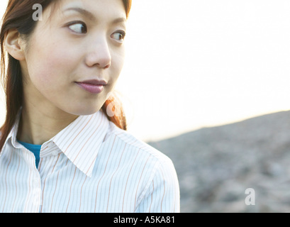 Young woman looking sideways Stock Photo