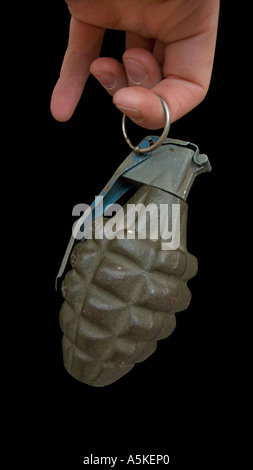 Hand grasping a hand grenade Familiar pineapple form M21 grenade Stock Photo