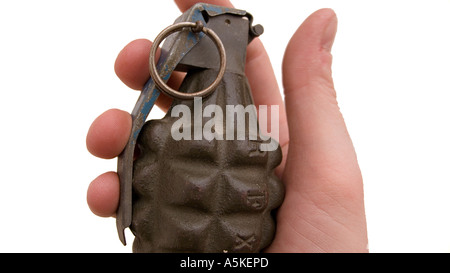 Hand grasping a hand grenade Familiar pineapple form M21 grenade as manufactured by the Richmond Foundry Mfg Co Inc USA Stock Photo