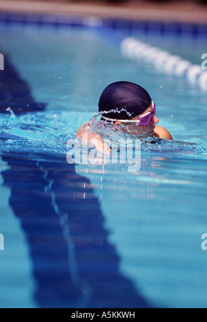 VA Chesapeake Riverwalk Pool woman swimmer doing freestyle in cap and goggles Stock Photo