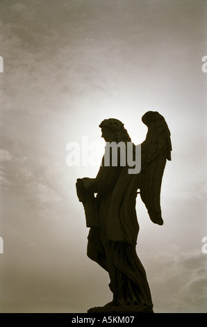 backlit angel statue on ponte sant angelo rome  Stock Photo