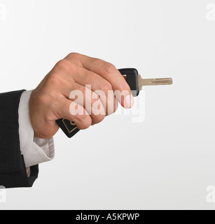 Studio shot of businessman holding car keys Stock Photo