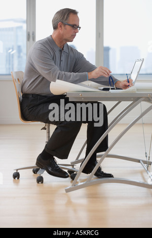 Businessman working at desk Stock Photo