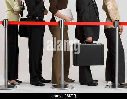 group of people standing in line Stock Photo
