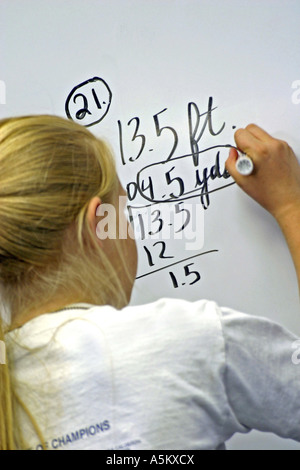 school girl doing math problems on the chalkboard Stock Photo - Alamy