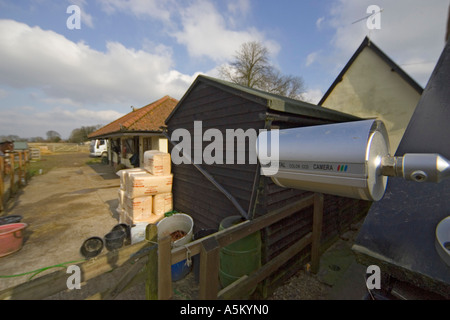 CCTV camera watching over stable block Stock Photo