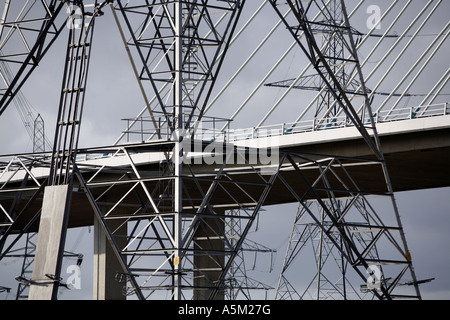 Dee river crossing and electricity pylons Stock Photo
