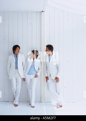 Two men and a woman talking Stock Photo