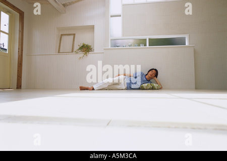 Asian Man lying on the floor Stock Photo