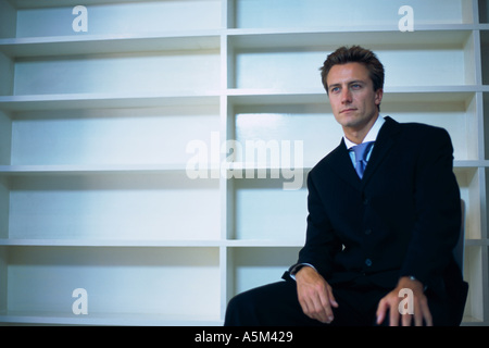 Caucasian man sitting in an empty office Stock Photo